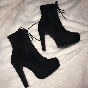 Black heeled lace up boots